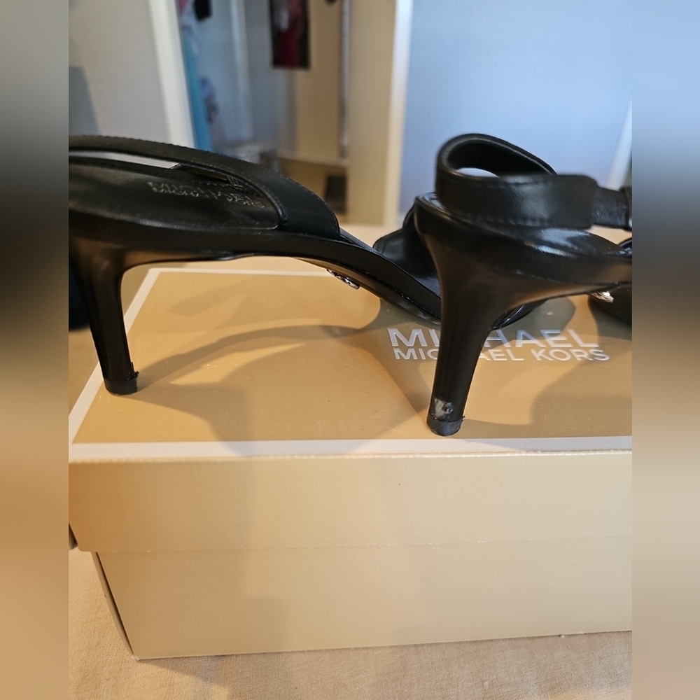 Michael Kors leather black sling back sandals 2 1/2 inches or so.